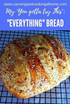 a loaf of bread sitting on top of a cooling rack with the words, my you gotat try this everything's bread