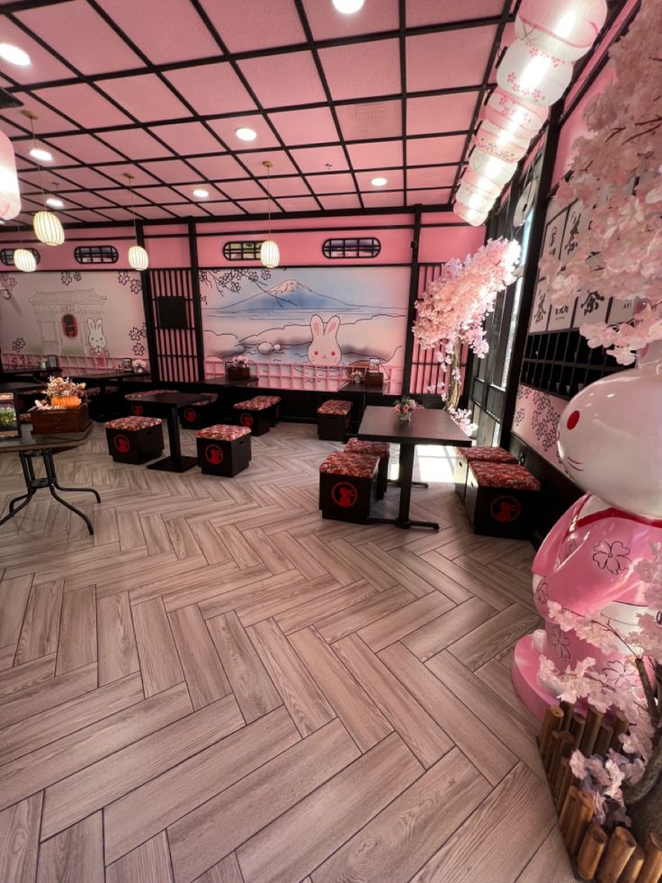 the interior of a restaurant with cherry blossom decorations and wooden flooring on the walls