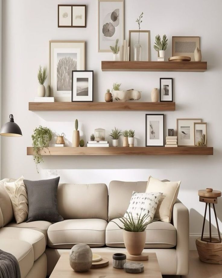 a living room filled with furniture and lots of shelves on the wall above it's couch