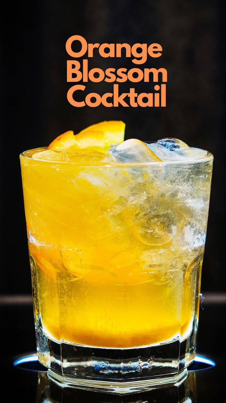 an orange blossom cocktail in a glass with ice