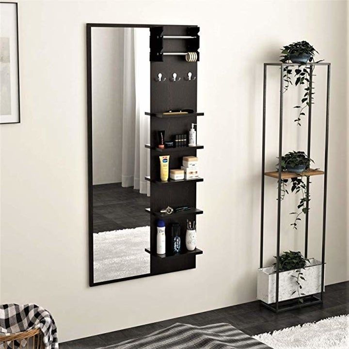 a mirror and shelf in a room