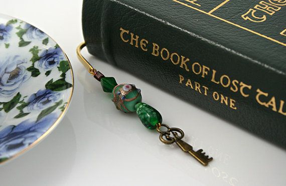 a book with a keychain on it next to a plate and a book