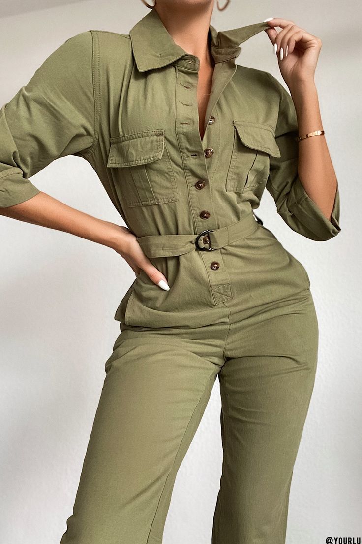 Our Women's Secrets Button-Up Jumpsuit features four functional pockets on front, two stitched-in, decorative pockets on back, collar, front buttons, belt loops with double d-ring belt buckles and a roomy fit for that perfect workwear vibe. You can never go wrong wearing this army-chic look. Measurement (Based on size 5) - Across Shoulder, Seam To Seam: 15” - Chest Circumference: 37” - Sleeve Opening (Cuffed): 14.5” - Waist Circumference (Straight Across): 33 - Inseam (Uncuffed): 28” - Leg Openi Trendy Collared Jumpsuits And Rompers With Button Closure, Belted Button-up Jumpsuits And Rompers For Spring, Belted Button-up Jumpsuit For Spring, Spring Belted Button-up Jumpsuits And Rompers, Spring Button-up Belted Jumpsuits And Rompers, Utility Long Sleeve Jumpsuits And Rompers With Button Closure, Casual Workwear Jumpsuit With Flap Pockets, Utility Style Jumpsuits And Rompers With Buttons For Fall, Casual Belted Collared Jumpsuits And Rompers