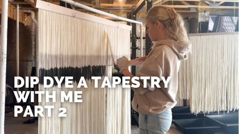 a woman standing in front of a wall hanging with white yarn on it and the words dip dye a tapestry with me part 2