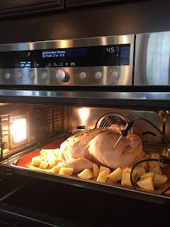 a turkey is being cooked in the oven