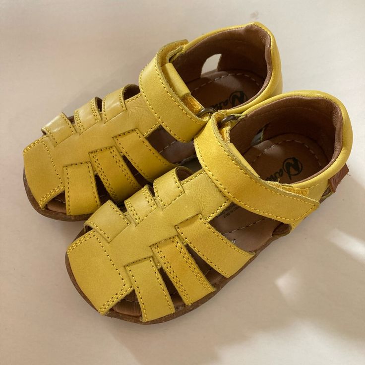 Beautiful, Never Worn Naturino See“ Semi-Closed Leather Sandals In Yellow. Eu Size 24 Which Is Us Size 7.5 According To The Brand‘s Sizing Chart: Https://Www.Naturino.Com/Shop/Us_en/Sandales-Semi-Fermee-En-Cuir-Jaune-Naturino-See.Html Cute Summer Sandals With Rubber Sole, Non-slip Closed Toe Leather Sandals, Non-slip Leather Closed Toe Sandals, Casual Sandals With Soft Sole And Round Toe, Spring Non-slip Sandals With Round Toe, Playful Closed Toe Sandals With Soft Sole, Yellow Non-slip Sandals With Round Toe, Yellow Non-slip Round Toe Sandals, Casual Closed Toe Sandals With Soft Sole