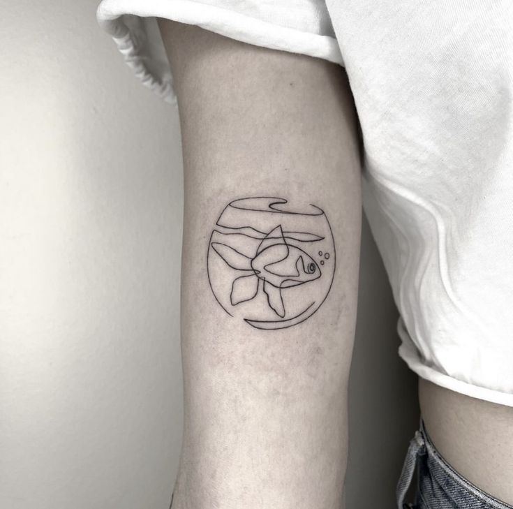 a small fish in a bowl tattoo on the left inner forearm and arm, with an abstract line work design