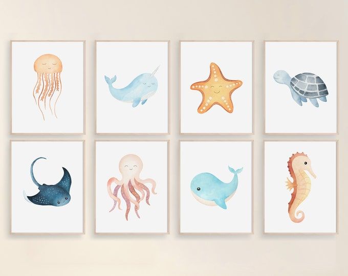 four paintings of sea animals are hanging on the wall