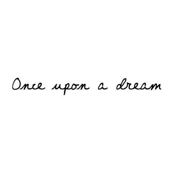 the words one upon a dream written in black ink