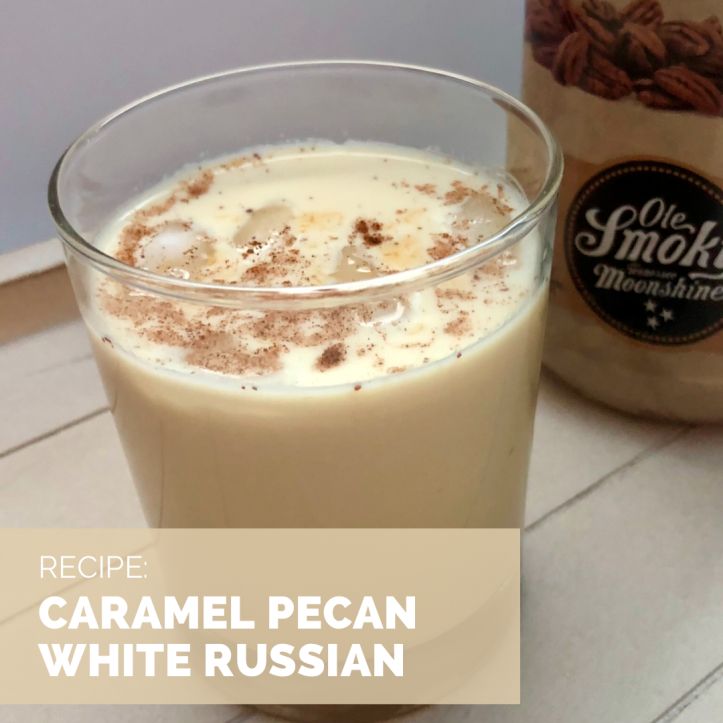 there is a cup of coffee with white russian cream in it