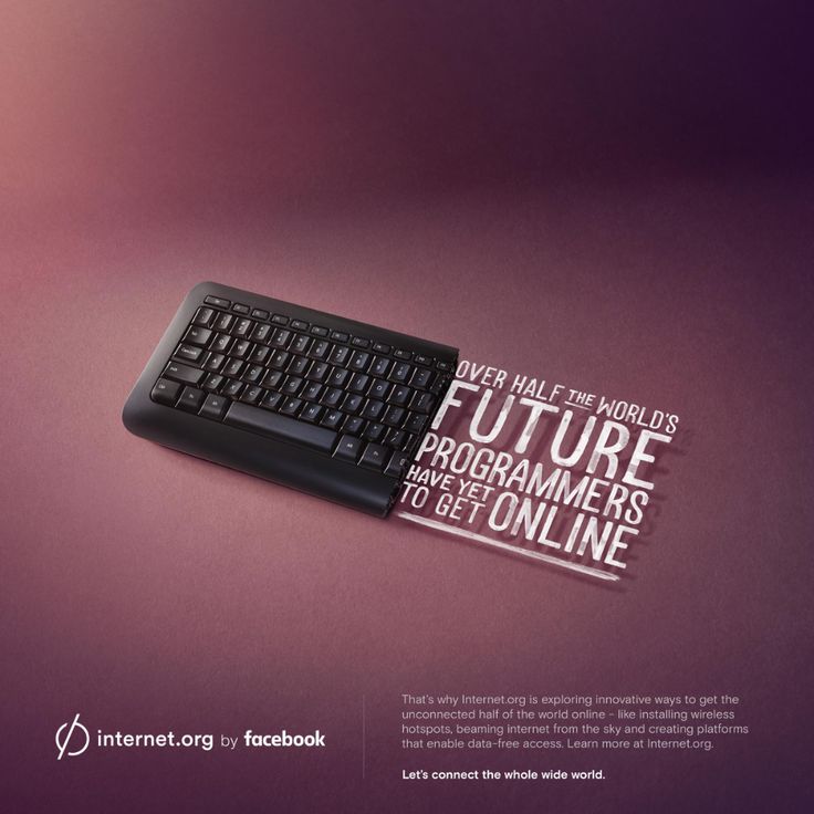 a computer keyboard sitting on top of a purple surface