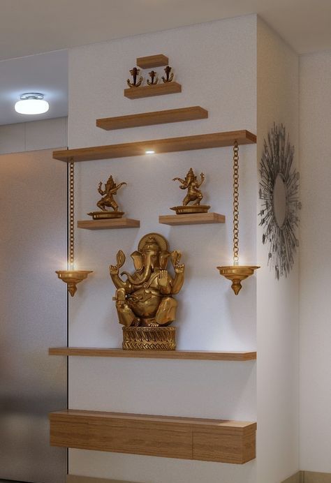 a gold statue sitting on top of a wooden shelf