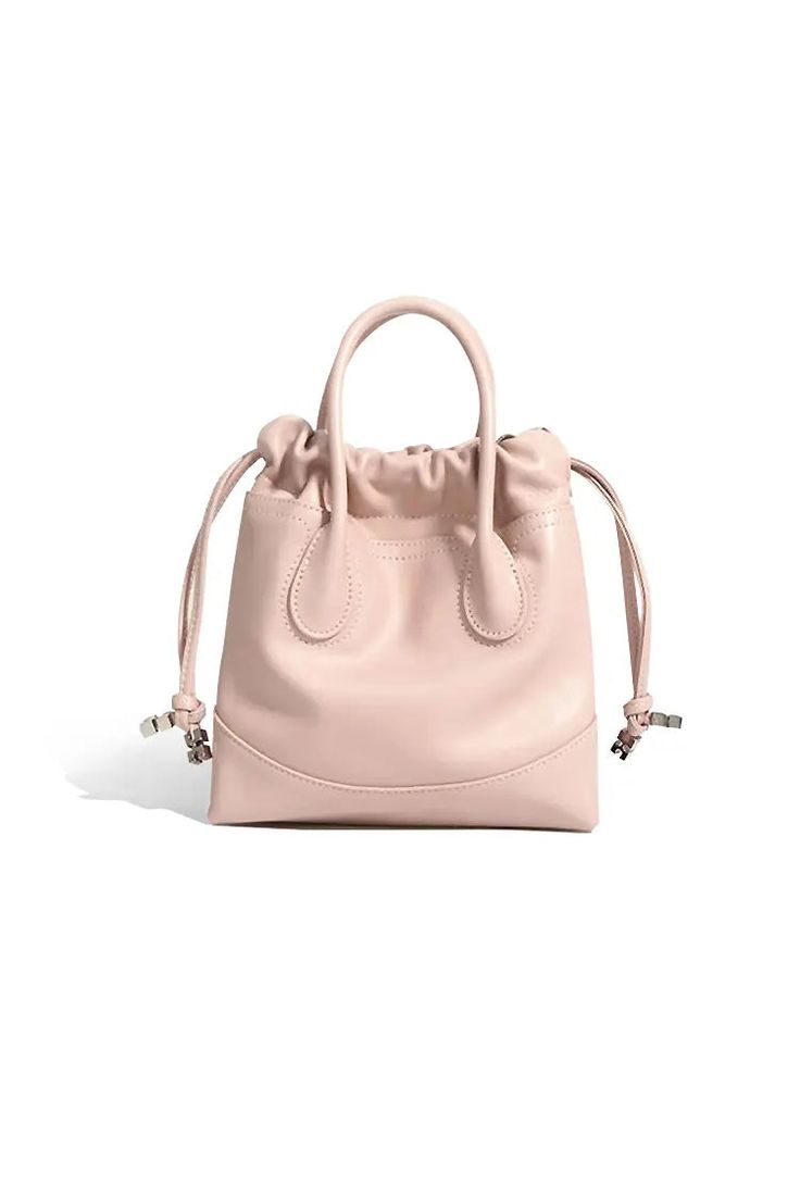 Perfectly Crafted Leather Mini Tote for Every Occasion Introducing our 2024 Leather Mini Tote Bag, crafted from premium calfskin in a soft pink hue. This stylish bag features sturdy top handles and an adjustable shoulder strap, offering versatile carrying options. The unique drawstring design enhances security while adding a playful touch. Perfect for daily commutes and casual outings. Style #: WWAJ804