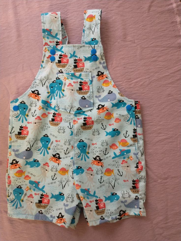 These sea creature overalls are the perfect outfit for a summertime play date, outing, photo shoot and more! These overalls feature kam snaps for adjustable straps as well as easy changing time. Made with 100% cotton, making them lightweight and comfortable for your little one. Cotton Jumpsuits And Rompers With Pockets For Playwear, Playwear Jumpsuits And Rompers With Pockets, Playwear Overalls Jumpsuits And Rompers With Pockets, Summer Shortalls For Beach, Casual Playtime Overall Jumpsuits And Rompers, Casual Playtime Overalls And Rompers, Summer Beach Shortalls Overall, Casual Overall Jumpsuits And Rompers For Playtime, Summer Beach Shortalls