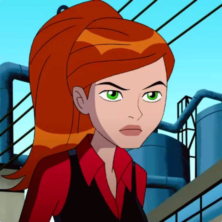 a woman with red hair and green eyes standing in front of an industrial area, looking at the camera