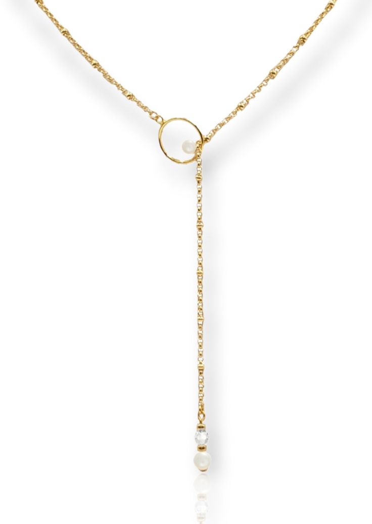 The MILA lariat necklace is perfect for your wedding day or just every day. Due to the lariat design, it can be worn in the front or back. This modern necklace has a circle pendant with a 6mm pearl on the inside. At the other end, there is an Austrian crystal and pearl that pulls through. Available in a bright silver or trendy gold, this necklace measures to approximately 24 inches in length. Adjustable Pearl Pendant Lariat Necklace, Pearl Lariat Necklace With Adjustable Chain, Adjustable Pearl Lariat Drop Necklace, Adjustable Dangle Lariat Necklace With Pearl Pendant, Adjustable Lariat Necklace With Pearl Pendant, Dainty Adjustable Lariat Necklace With Pearl Pendant, White Lariat Necklace With Pearl Pendant, White Pearl Pendant Lariat Necklace, Adjustable Long Lariat Necklace With Pearl Drop