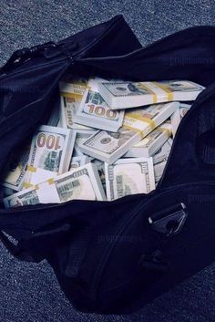 a bag full of money sitting on the ground