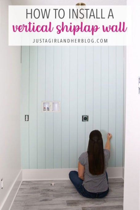 a woman sitting on the floor in front of a wall with text overlay that reads how to install a vertical shiplap wall