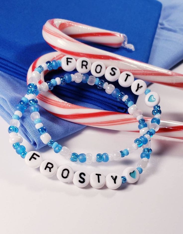 two bracelets that say frosty, frosty and frosty with candy canes