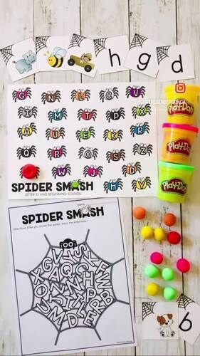 the spider smash activity is displayed on a table with markers, beads and pencils