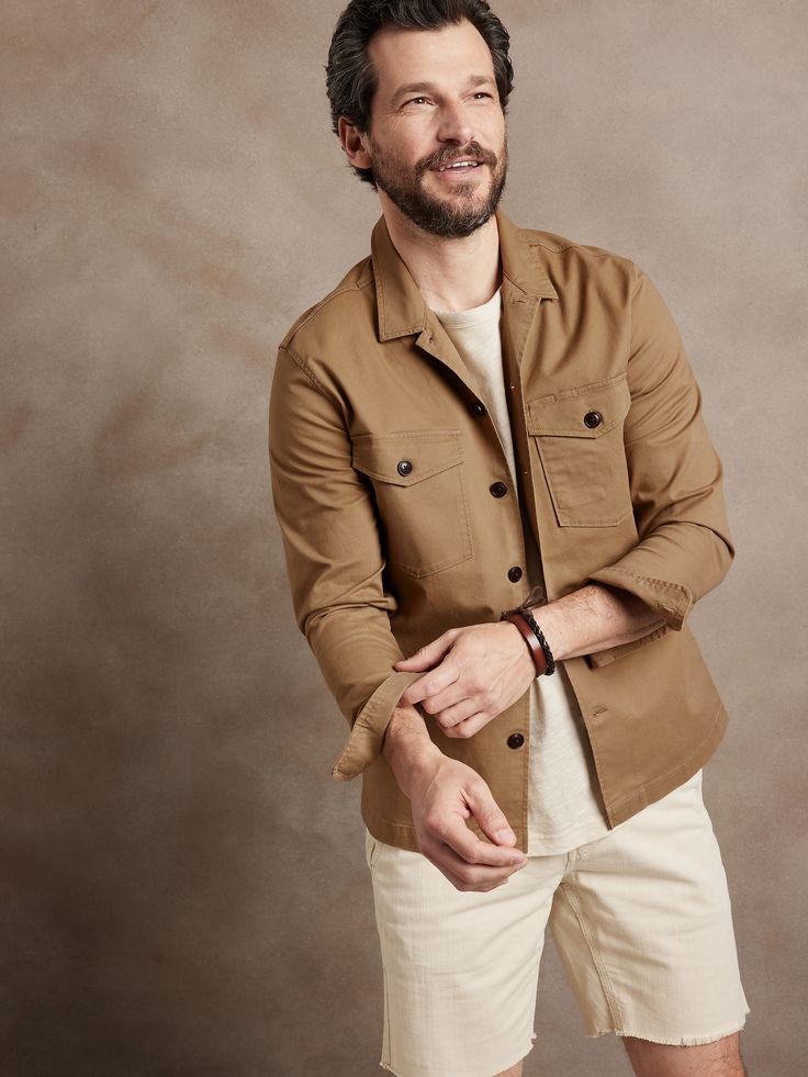 An splendid example of rugged luxury, this magnificent shirt jacket is based on a piece from the archives, crafted here in a soft cotton twill, a delightful contrast to its masculine silhouette.  Point collar.  Chest pockets.  Button front.  Straight Classic Shacket With Camp Collar And Pockets, Classic Brown Utility Jacket With Buttoned Pockets, Classic Cotton Shacket With Patch Pockets, Brown Cotton Shacket With Buttons, Cotton Shacket With Lapel Collar And Welt Pockets, Brown Cotton Utility Jacket With Buttoned Pockets, Collared Cotton Shacket With Welt Pockets, Unstructured Utility Jacket With Lapel Collar, Unstructured Long Sleeve Utility Jacket With Button Closure