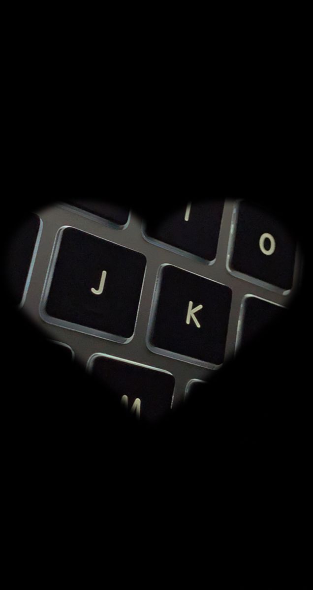 a computer keyboard with the letter j on it's keys in the shape of a heart