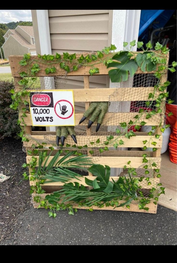 a wooden crate filled with lots of green plants