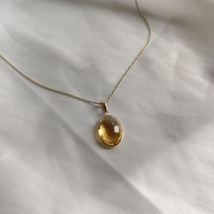 This stunning Pendant is set in 14k Solid Yellow Gold with Natural Citrine with utmost precision. It is a unique gemstone Pendant for nearly every occasion and is completely hassle-free jewelry. ITEM DETAILS: * GEM: Citrine * GEM SIZE: 12X16mm * GEM SHAPE: Oval * Gem Weight: 8.75 carats * Gold Purity: 14KT * Gold Weight: 0.60 gram * Total Weight of the Pendant: 2.35 gram The Gold purity is guaranteed and it comes with authentic 14KT gold hallmark. Since my items are handmade, they are absolutely nickel and lead free. CUSTOMIZATION: * Gemstone customization is available and it can be substituted with a gem of your choice. Kindly message me for the same. PACKAGING * The Pendant comes with layers of safe and secure wrapping along with Free handmade jewelry box with every purchase. ➡️Head to t Yellow Gem Necklace, Topaz Jewelry Yellow, Yellow Jewelry Aesthetic, Gem Stone Jewelry, Sunny Disposition, Yellow Gems, Handmade Jewelry Box, Citrine Jewelry, Yellow Necklace