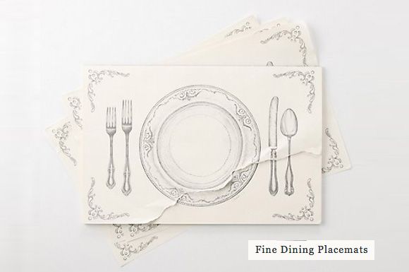 two placemats with silverware on them are sitting next to each other in front of a white background