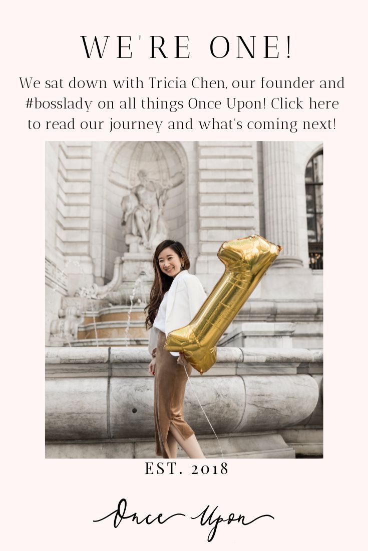 a woman holding an inflatable balloon with the words, we're one