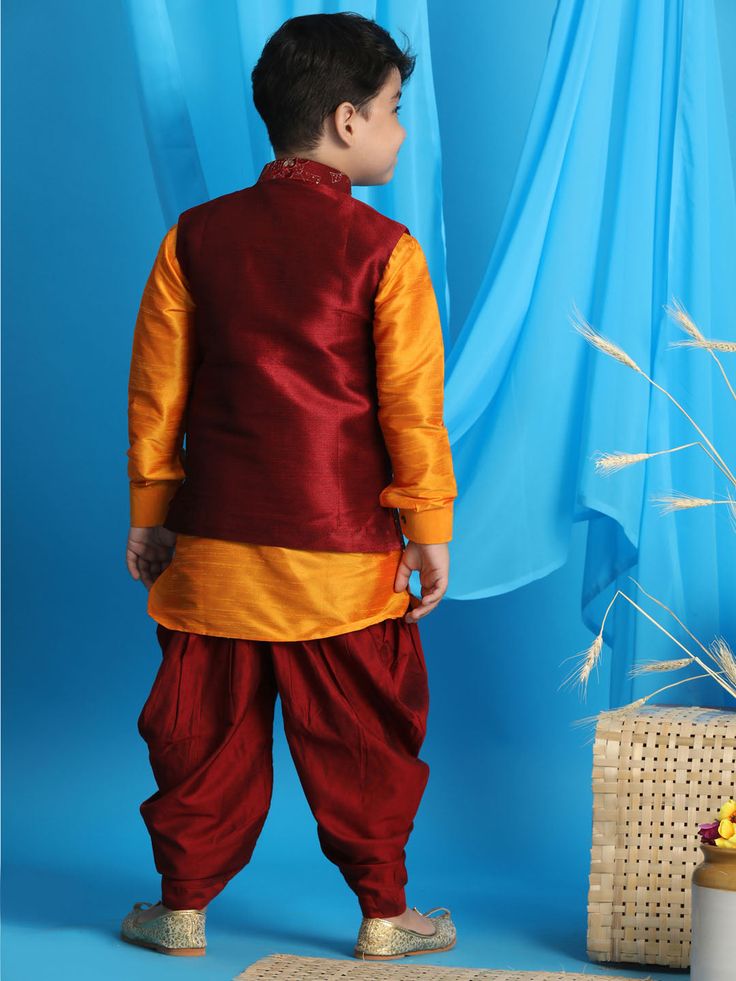 JBN CREATION Boy's Maroon Embroidered Nehru Jacket With Orange Kurta And Maroon Dhoti Set Dress your little one in sophisticated style with this JBN Creation set. Featuring a maroon embroidered Nehru jacket, a vibrant orange kurta, and a matching maroon dhoti, this ensemble is perfect for special occasions and traditional ceremonies. Key Features Maroon embroidered Nehru jacket with mandarin collar Contrasting orange kurta with full sleeves and knee length Maroon dhoti for a complete traditional Festive Stand Collar Traditional Wear For Diwali, Multicolor Nehru Jacket With Resham Embroidery For Diwali, Nehru Jacket With Resham Embroidery For Navratri, Stand Collar Bandhgala For Diwali Festive, Festive Stand Collar Bandhgala For Diwali, Stand Collar Bandhgala For Diwali, Diwali Festive Bandhgala With Stand Collar, Traditional Nehru Jacket With Stand Collar For Festive Occasions, Traditional Festive Outerwear For Diwali