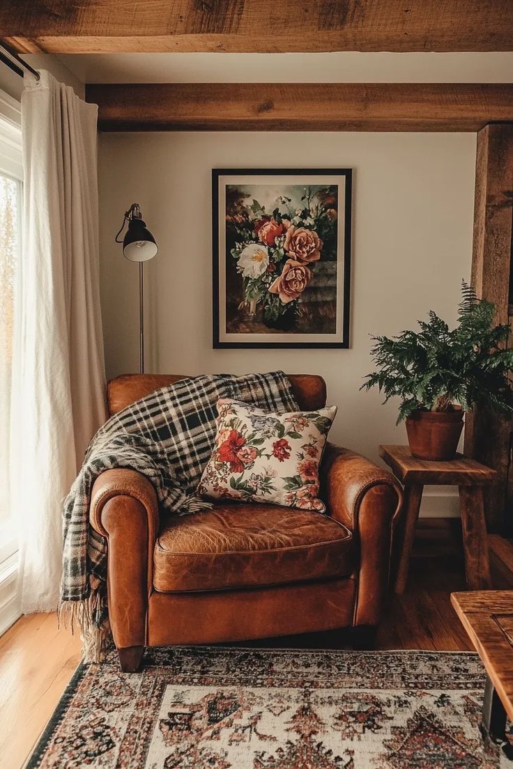 a living room with a couch, chair and rug on the floor next to a window