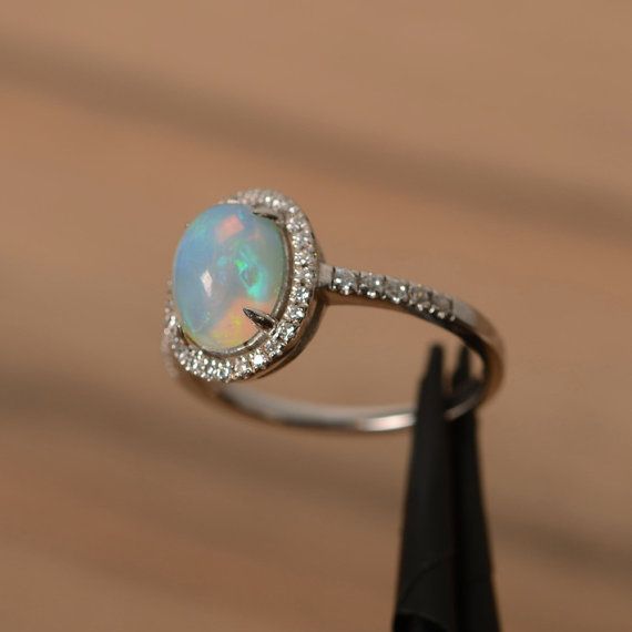 natural opal ring silver halo ring oval cut white opal engagement ring natural gemstone rings for wo Silver Oval Opal Birthstone Ring, Silver Opal Crystal Ring Oval Shape, Classic Silver Hallmarked Opal Ring, Affordable Silver Opal Ring, Oval Shaped, Opal Ring Silver, White Opal Engagement Ring, Sterling Silver Opal Ring For Wedding, Oval Cabochon, Silver Halo Ring, October Birthstone Ring