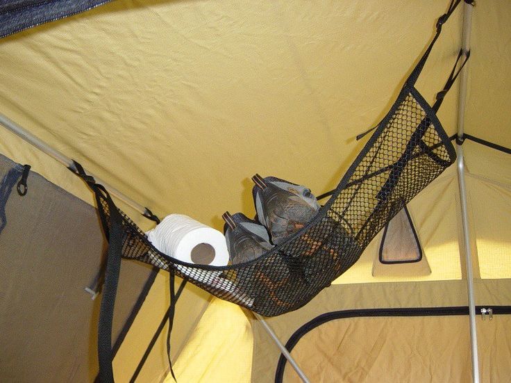 the inside of a tent with toilet paper and other items