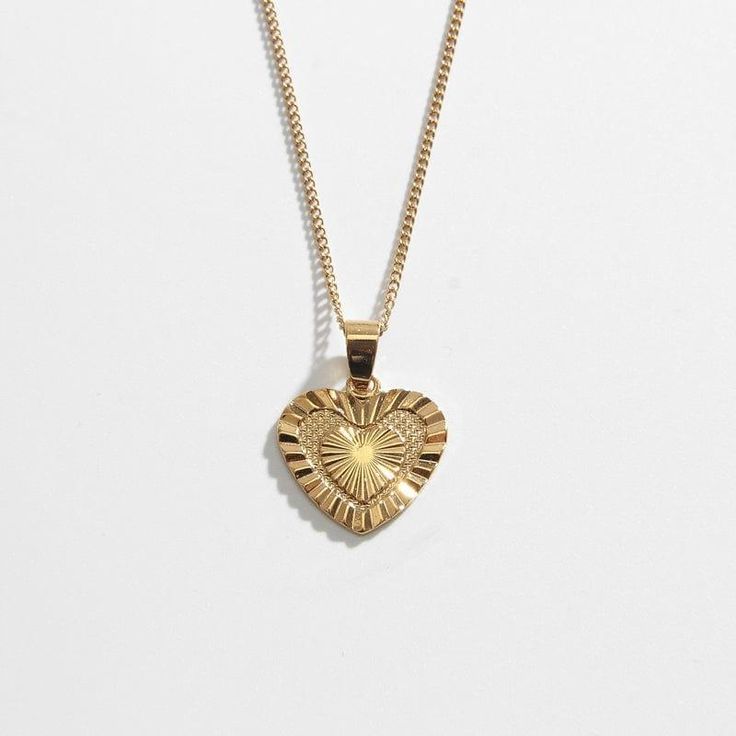 Vintage Gold-plated Tarnish-resistant Charm Necklaces, Vintage Gold Plated Tarnish Resistant Charm Necklace, Vintage Gold-plated Tarnish-resistant Charm Necklace, Gold Brass Heart Charm Necklaces, Gold Brass Charm Necklace With Heart Charm, Gold-tone Heart Pendant Necklace, Gold Heart Pendant Necklace With Clavicle Chain, Gold Heart Pendant Clavicle Necklace, Dainty Heart Pendant Jewelry With Vintage Charm