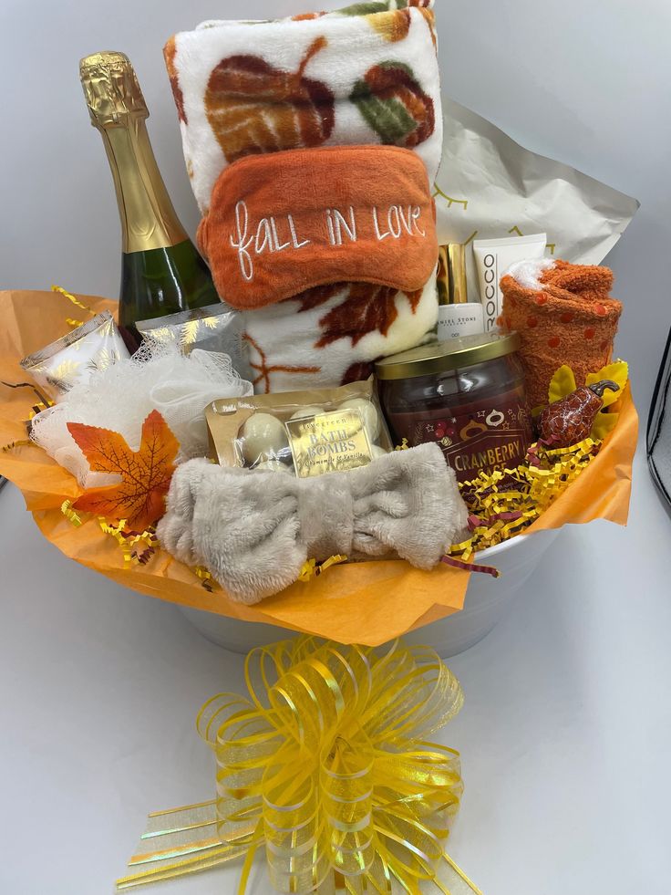 a gift basket filled with wine, cheese and other items for someone's special occasion