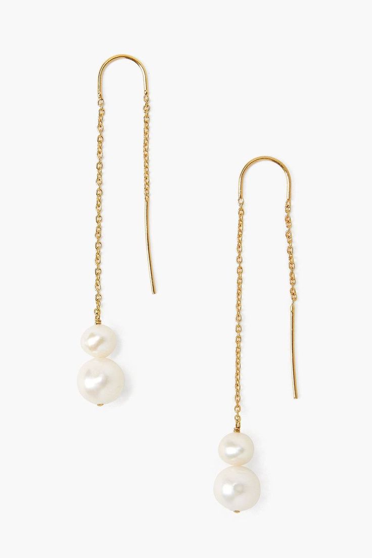 The modern thread-thru earring gets a touch of classic style with the addition of floating pearls. These lightweight earrings feature luminous freshwater white pearls on an 18k gold plated sterling silver chain. 2.25" drop. Handmade in Vietnam. Cheap White Drop Jewelry, Cheap White Minimalist Earrings, Cheap Minimalist White Earrings, Cheap Minimalist Wedding Earrings, Cheap Timeless White Jewelry, Cheap Chic White Jewelry, Cheap White Pearl Drop Jewelry, Cheap Pearl Drop Jewelry For Party, Cheap Chic Pearl White Jewelry