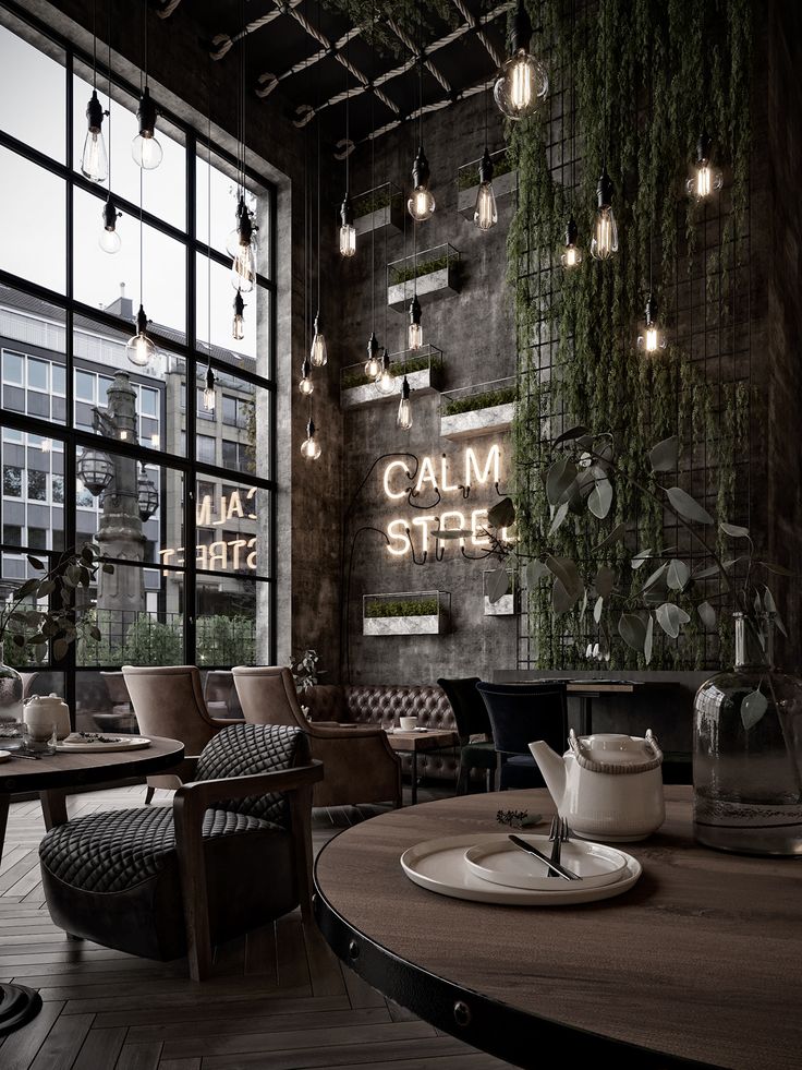 the interior of a restaurant with wooden tables and chairs