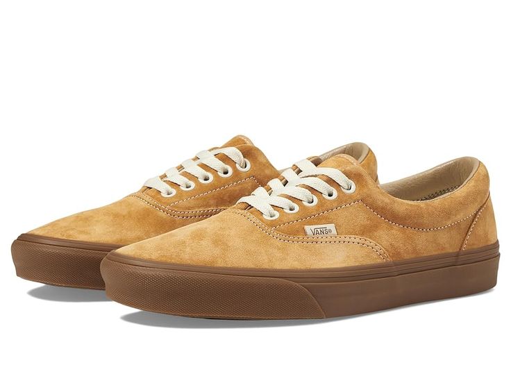 Vans Era - Skate Shoes : Pig Suede Gum Antelope : The Vans Era skate shoes keep your style going strong with clean and uncomplicated style, with more padding than the classic Authentic. Skateboard shoes with a low-top silhouette. Uppers of canvas, leather, or man-made materials with a double-stitched vamp. Cotton drill lining for breathable wear. Padded collar for added support. Die-cut EVA insert for reliable comfort. Vulcanized sole attachment with iconic waffle outsole for grippy wear and boardfeel. Imported. Measurements: Weight: 15 oz Product measurements were taken using size Men's 9, Women's 10.5, width Medium. Please note that measurements may vary by size. Leather Sneakers With Vulcanized Sole For Skateboarding, Vans Low-top Skate Shoes With Rubber Toe Cap, Vans Leather Low-top Skate Shoes, Vans Leather Skate Shoes With Rubber Sole, Leather Skate Shoes With Gum Sole For Everyday, Everyday Leather Skate Shoes With Gum Sole, Everyday Lace-up Skate Shoes With Contrast Sole, Vans Suede Skate Shoes With Round Toe, Vans Lace-up Skate Shoes With Vulcanized Sole