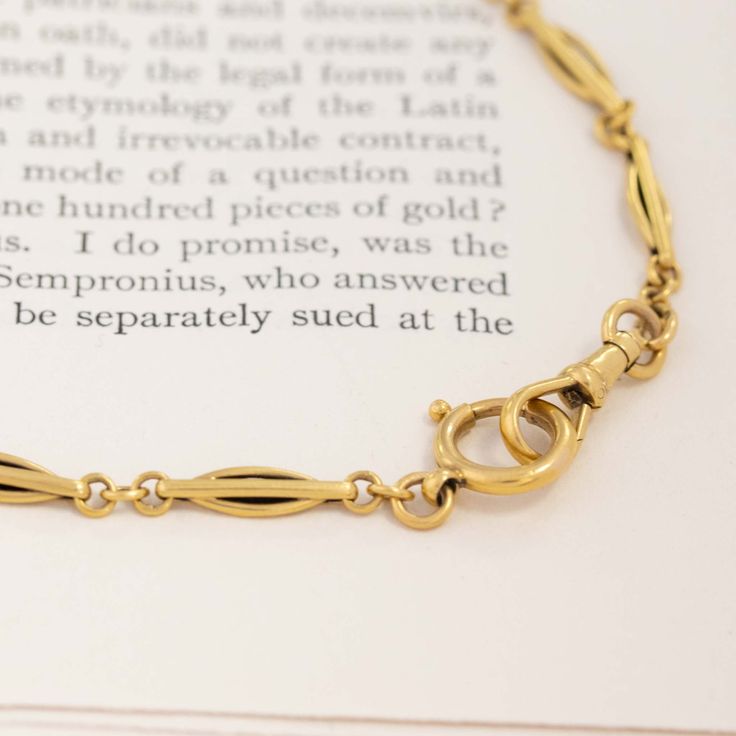 One of the most charming antique chains we have the pleasure of offering! Simple in its styling with the elegantly elongated links, and finished with a dog clip and oversized lock. And my most favorite part? The dramatic length! It's perfect worn doubled or even tripled. 18kt yellow gold 18.1 pennyweightMeasures 61.5" in length. Please see qualitative report for more information. Classic Formal Chain Bracelet With Hooks And Links, Elegant Double Chain Brass Necklace, Classic Gold Chain Bracelet With Hooks And Links, Elegant Brass Double Chain Necklace, Gold Chain Bracelet With Hooks And Links, Elegant Oval Link Brass Chain Bracelet, Elegant Gold Chain Bracelet With Hooks And Links, Elegant Oval Chain Necklace With Lobster Clasp, Elegant Formal Chain Bracelet With Hook And Links