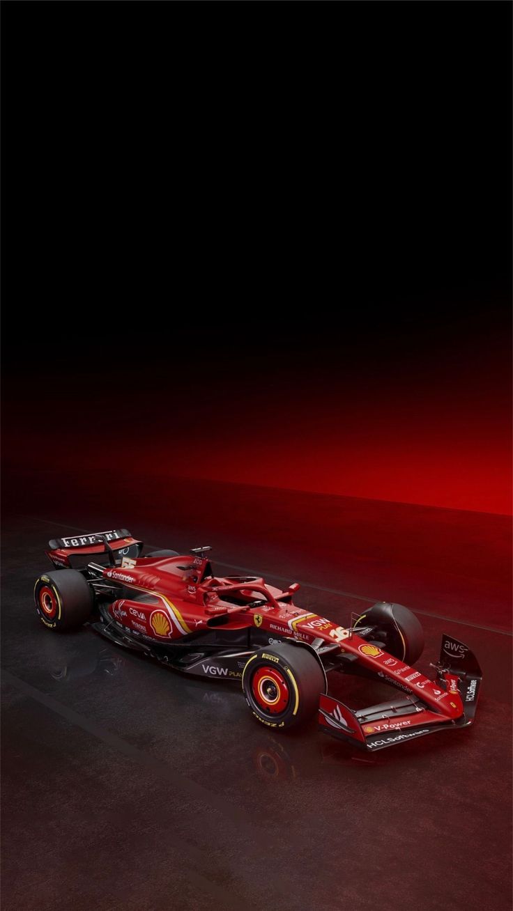 a red and black race car on a dark background