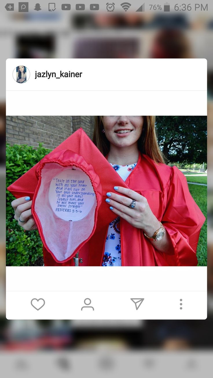 a woman in a graduation gown is holding up a red jacket with the words, i love you on it