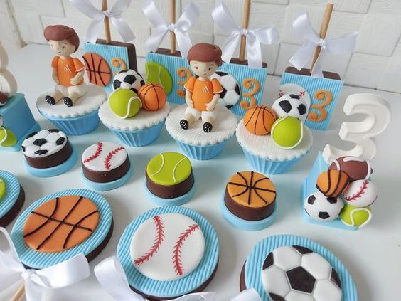 cupcakes decorated with sports themed decorations