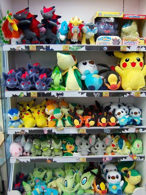 the shelves are filled with pokemon stuffed animals