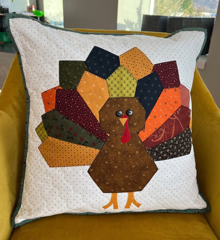 a decorative pillow with a turkey on it