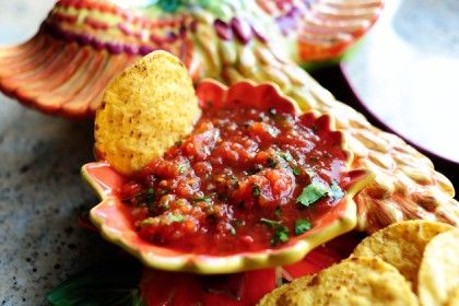 a bowl filled with salsa and tortilla chips