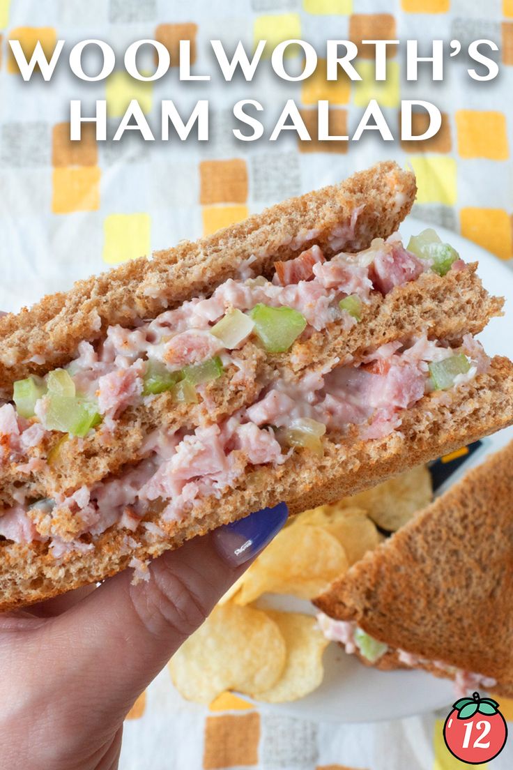 a hand holding a sandwich with ham and chips in front of the words woolworth's ham salad