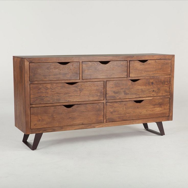 a wooden dresser with six drawers and two legs on the bottom, against a white background