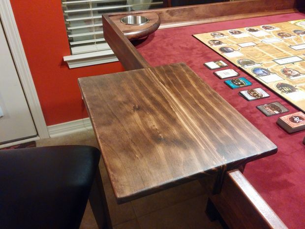 a wooden table topped with lots of cards