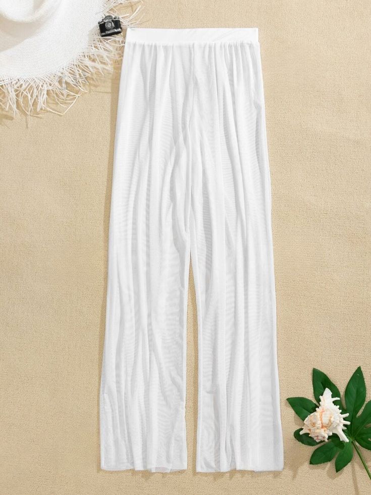 Elevate your beachwear with our Sheer Mesh Cover Up Pants, a perfect blend of style and comfort. Crafted from high-stretch 100% polyester fabric, these pants offer a good solution for your beach or poolside lounging. The sheer detailing adds a touch of sophistication, creating a statement piece that effortlessly transitions from the water to the shore. With a regular fit and a comfortable, unlined body, these cover-up pants strike the ideal balance between fashion and functionality. Embrace the Mesh Swimwear, Cover Up Pants, Mesh Cover Up, Sheer Pants, Cover Up Beach, Coverup Beach, Beach Wrap, Costume Intero, Swimwear Bottoms